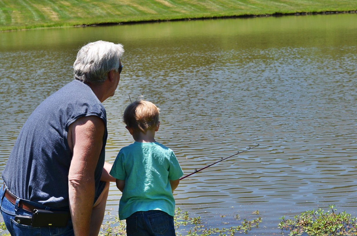 dad and son fishing at faulkner's ranch